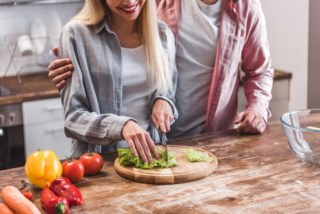 hobbies to improve yourself - woman cutting lettuce on cutting board