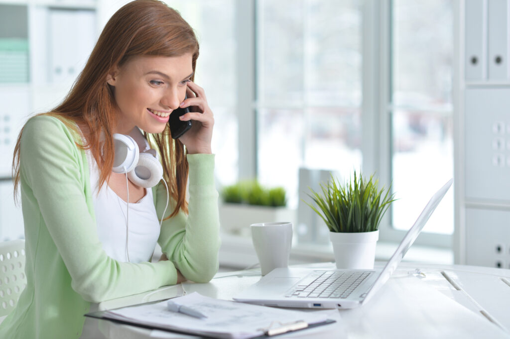 Entrepreneurial woman at home office desk considering certainty is a myth