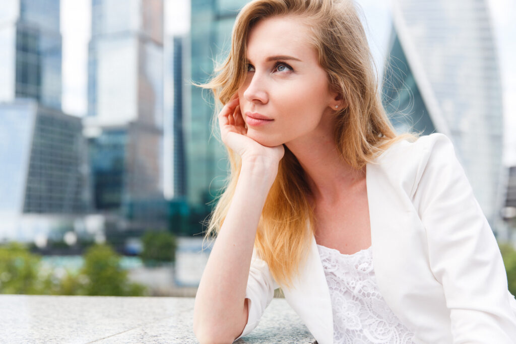 Portrait of young business woman pondering accepting her health challenges