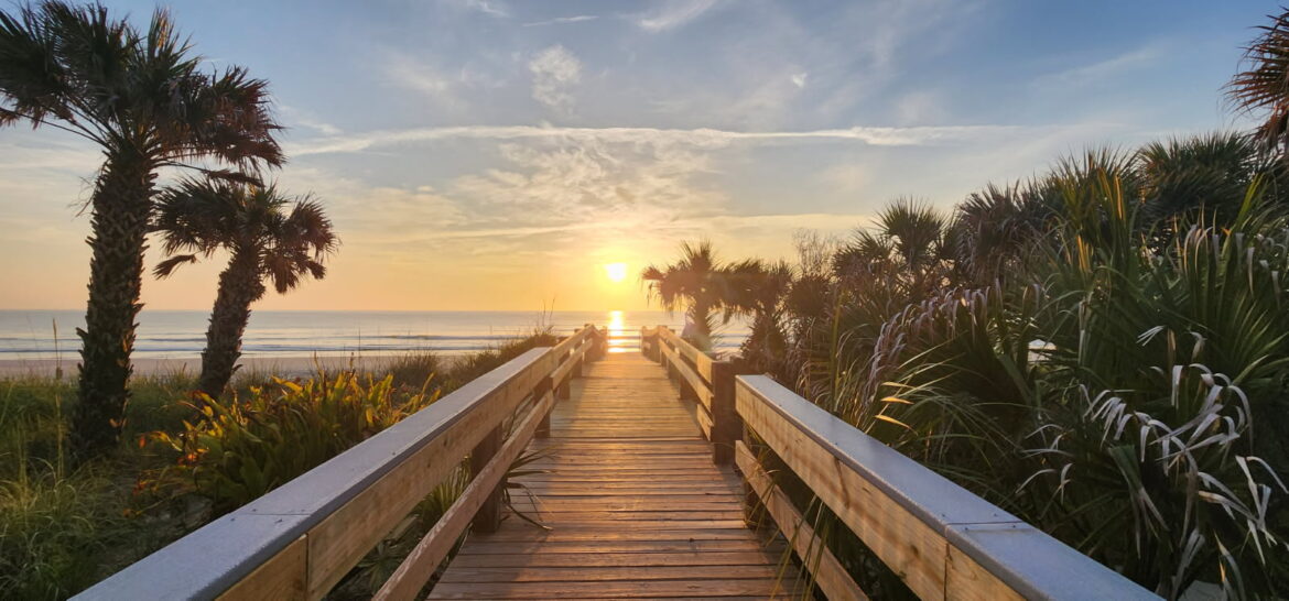 sunrise over a boardwalk
