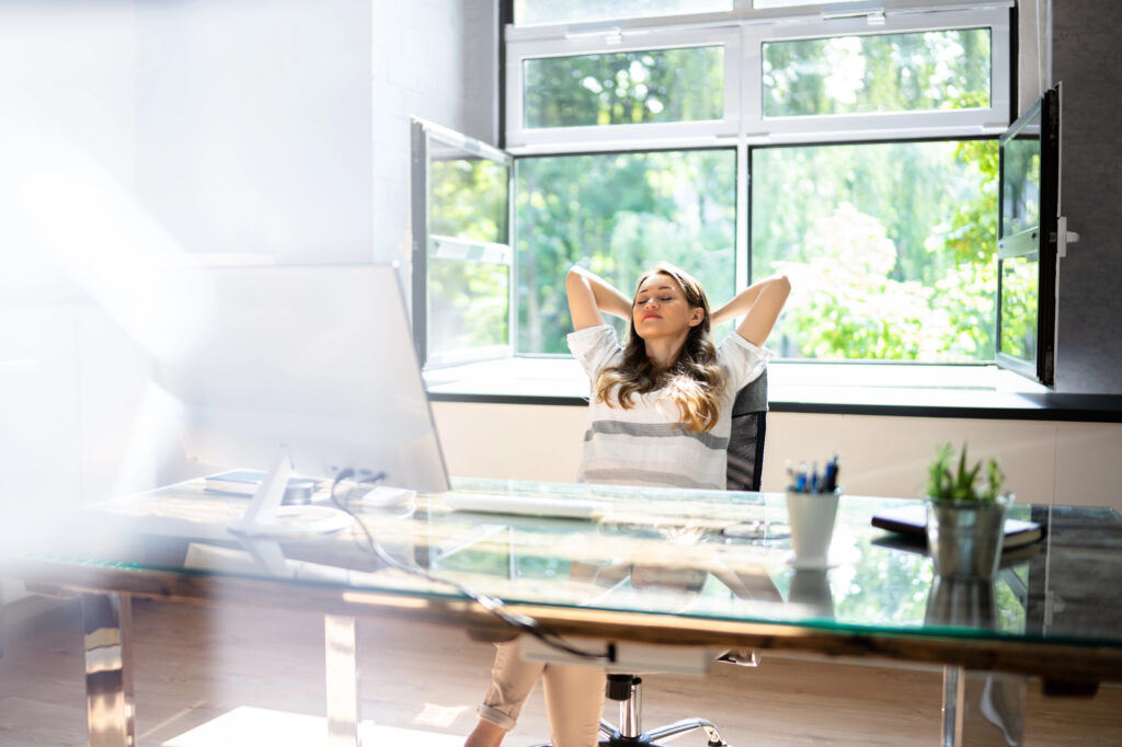 Business owner thoughtfully managing work with mindful breaks and adaptability to support health and productivity.
